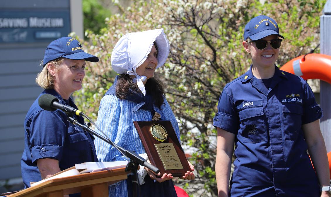 Retirement of Boston Light Keeper Dr. Sally Snowman at Hull Lifesaving Museum May 22 2024 Sally Snowman Captain Kaley Benson Lt Commander Kate Ahrens Plaque